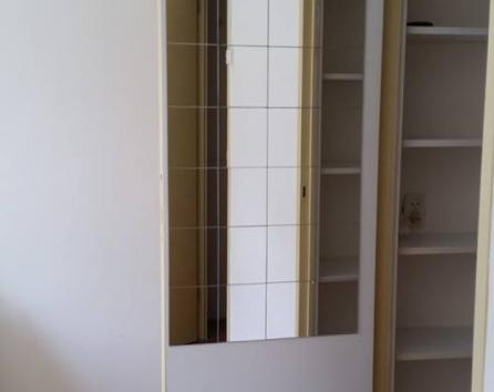 Closet of room with two single bed
